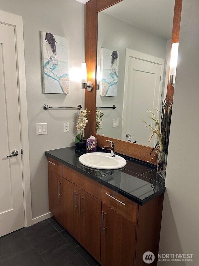 2721 1st Ave Unit 103, Seattle, WA 98121 - bathroom featuring vanity, tile patterned flooring, and baseboards