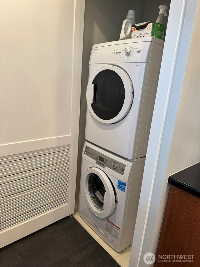 2721 1st Ave Unit 103, Seattle, WA 98121 - laundry room featuring stacked washer / drying machine