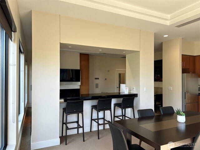 2721 1st Ave Unit 103, Seattle, WA 98121 - dining space featuring light carpet and recessed lighting