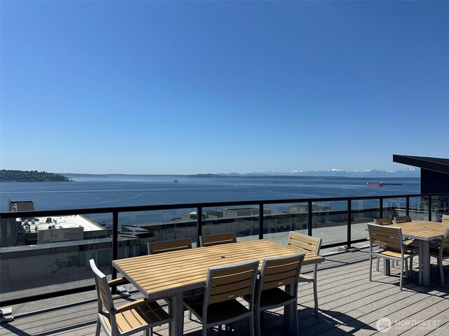 2721 1st Ave Unit 103, Seattle, WA 98121 - wooden terrace featuring outdoor dining space and a water view
