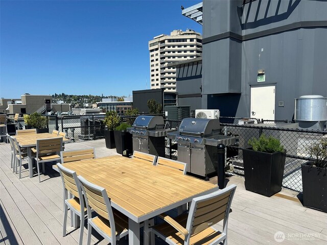2721 1st Ave Unit 103, Seattle, WA 98121 - deck with outdoor dining area and area for grilling