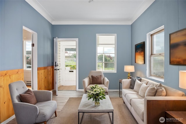 1118 W Wishkah St, Aberdeen, WA 98520 - sitting room featuring healthy amount of natural light, ornamental molding, wood finished floors, a baseboard radiator, and a wainscoted wall