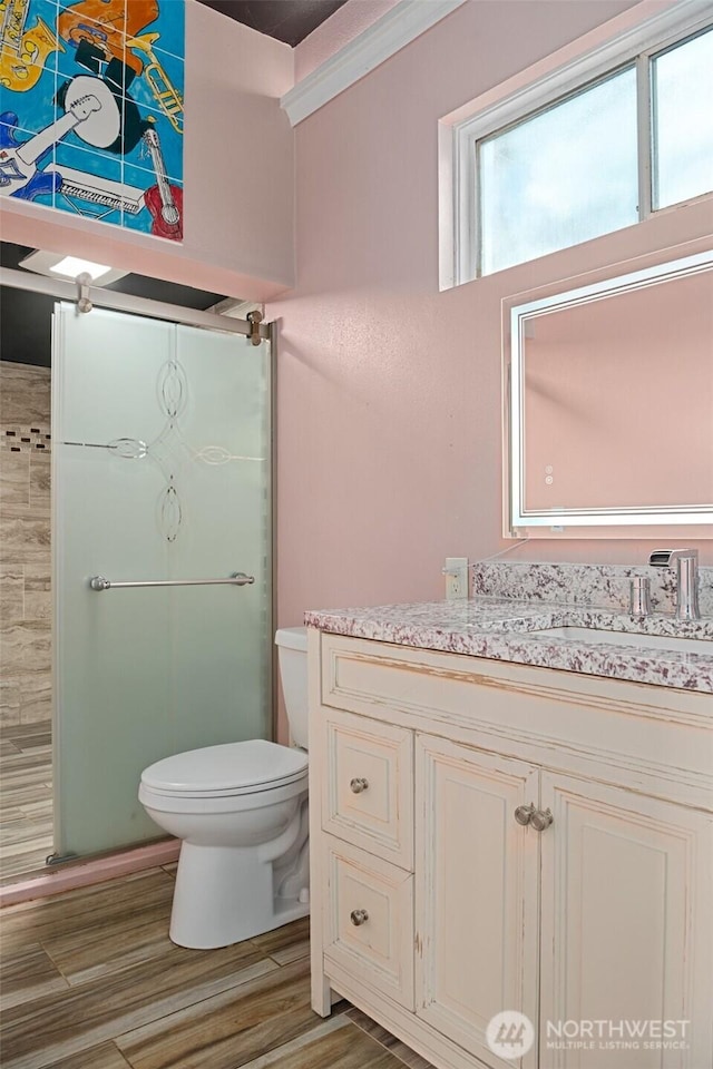 1118 W Wishkah St, Aberdeen, WA 98520 - bathroom with toilet, wood finished floors, vanity, and an enclosed shower