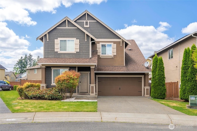 18410 20th Avenue Ct E, Spanaway, WA 98387 - craftsman-style home with a shingled roof, concrete driveway, and a garage