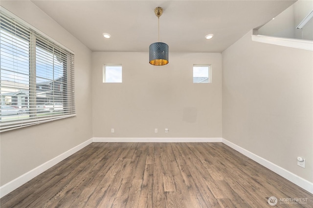 18410 20th Avenue Ct E, Spanaway, WA 98387 - unfurnished room with plenty of natural light, dark wood-style flooring, baseboards, and recessed lighting