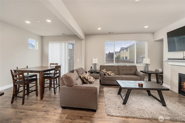 18410 20th Avenue Ct E, Spanaway, WA 98387 - living area featuring a tile fireplace, healthy amount of natural light, baseboards, wood finished floors, and recessed lighting