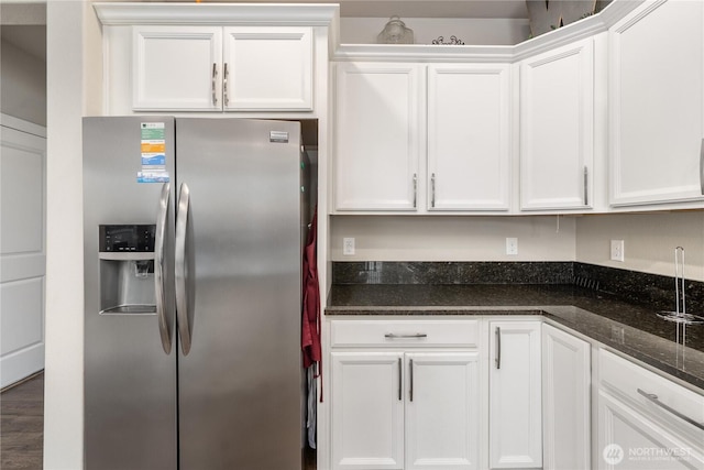 18410 20th Avenue Ct E, Spanaway, WA 98387 - kitchen featuring stainless steel fridge with ice dispenser, white cabinetry, and dark stone counters