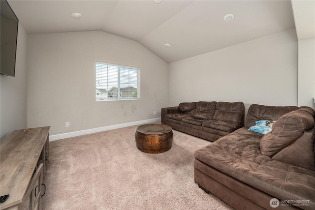 18410 20th Avenue Ct E, Spanaway, WA 98387 - carpeted living room featuring baseboards and lofted ceiling
