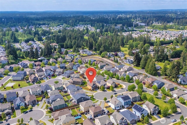 18410 20th Avenue Ct E, Spanaway, WA 98387 - aerial view of property and surrounding area with a heavily wooded area and nearby suburban area