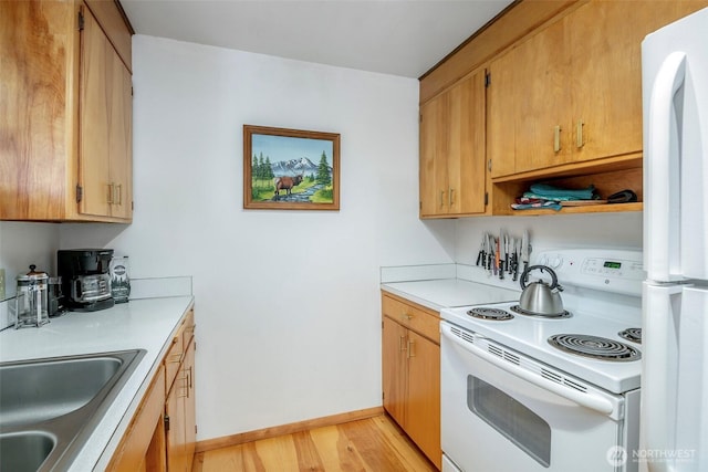 100 Aspen Ln, Packwood, WA 98361 - kitchen with white appliances, light wood-style floors, light countertops, and baseboards