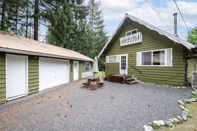 100 Aspen Ln, Packwood, WA 98361 - view of front of house featuring metal roof, an outbuilding, and a detached garage