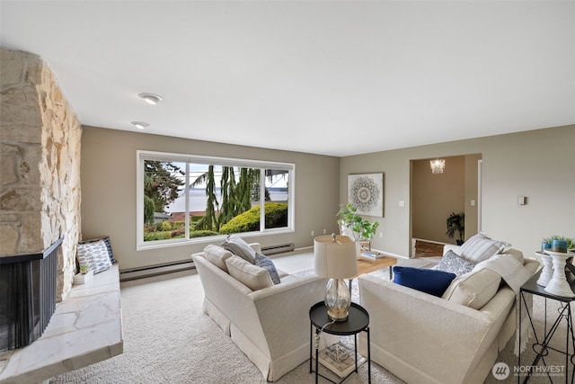 327 Priest Point Dr NW, Tulalip, WA 98271 - living room featuring a baseboard radiator, a chandelier, carpet flooring, and a fireplace