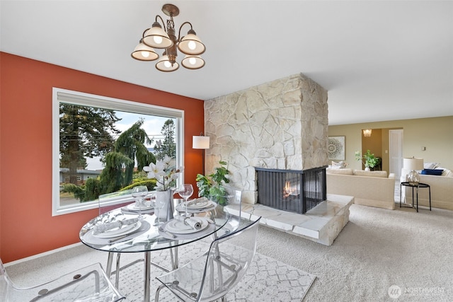 327 Priest Point Dr NW, Tulalip, WA 98271 - living area with carpet floors, a fireplace, and a chandelier