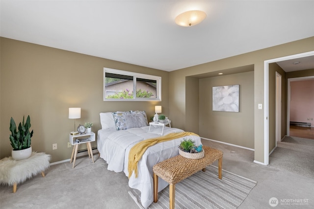 327 Priest Point Dr NW, Tulalip, WA 98271 - bedroom featuring light carpet, baseboards, and a baseboard radiator