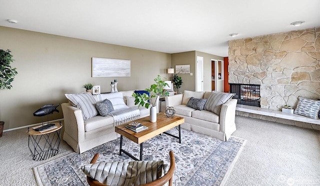 327 Priest Point Dr NW, Tulalip, WA 98271 - carpeted living area featuring a stone fireplace