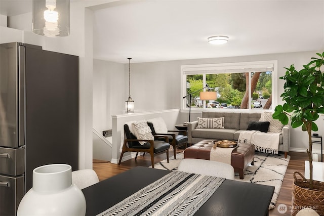 living room featuring wood finished floors and baseboards