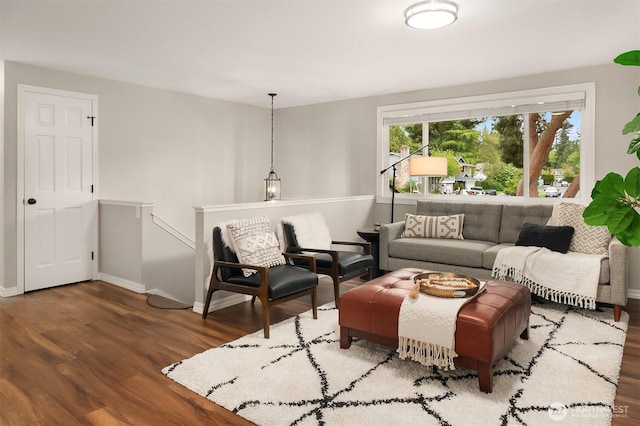 living room with wood finished floors and baseboards
