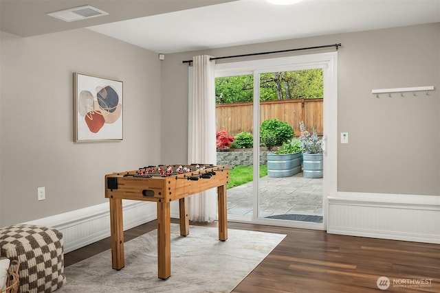 recreation room with wood finished floors