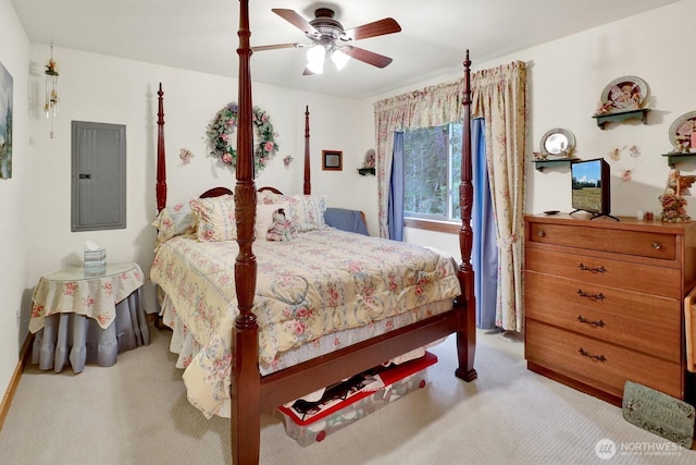 carpeted bedroom featuring electric panel and ceiling fan