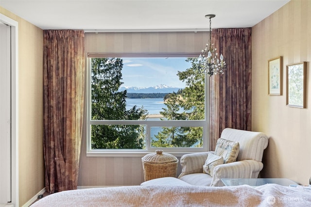 18617 S Vaughn Rd NW, Vaughn, WA 98394 - bedroom featuring wallpapered walls and a water and mountain view