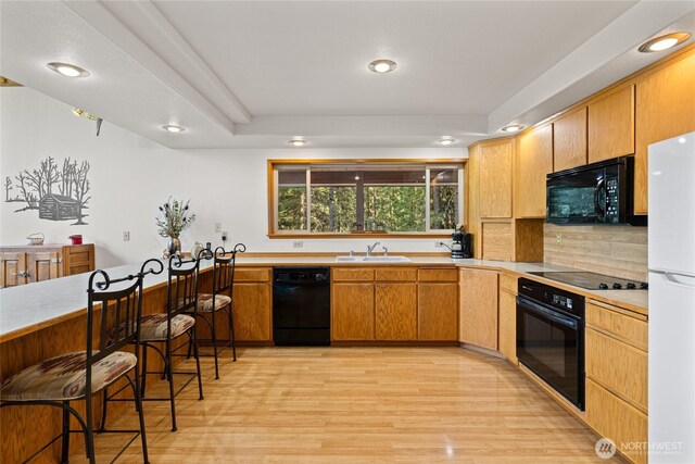 1101 Emerick Rd, Cle Elum, WA 98922 - kitchen featuring black appliances, a sink, light wood-type flooring, light countertops, and recessed lighting