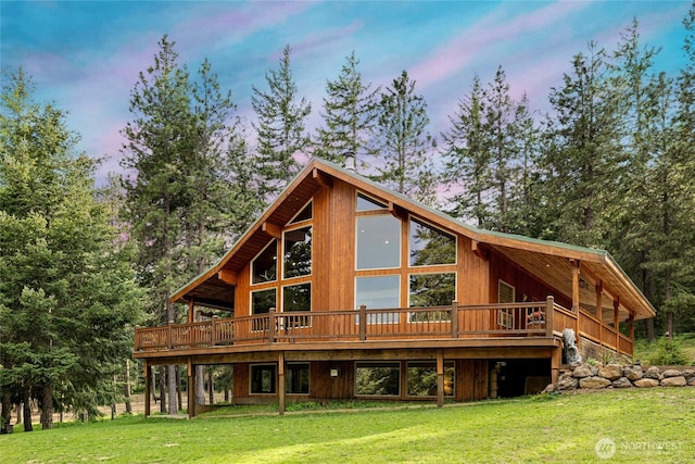 1101 Emerick Rd, Cle Elum, WA 98922 - back of house at dusk with a wooden deck and a yard