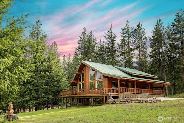 1101 Emerick Rd, Cle Elum, WA 98922 - view of property's community featuring a lawn, a deck, and view of scattered trees