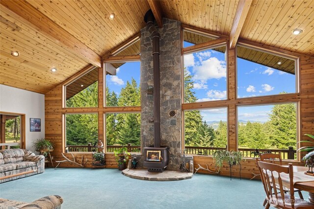 1101 Emerick Rd, Cle Elum, WA 98922 - carpeted living room with a wood stove, high vaulted ceiling, beamed ceiling, recessed lighting, and healthy amount of natural light
