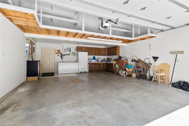 2798 N Nugent Rd, Lummi Island, WA 98262 - garage with freestanding refrigerator and a garage door opener