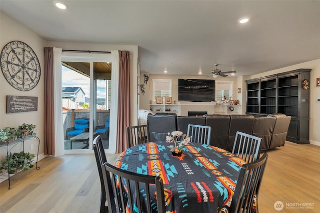 1436 Baker Heights Loop, Bremerton, WA 98312 - dining area featuring ceiling fan, light wood finished floors, baseboards, recessed lighting, and a fireplace