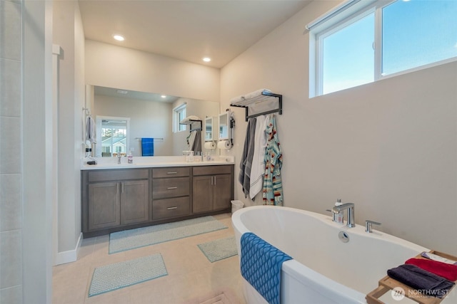 1436 Baker Heights Loop, Bremerton, WA 98312 - full bath with double vanity, a freestanding tub, recessed lighting, and tile patterned floors