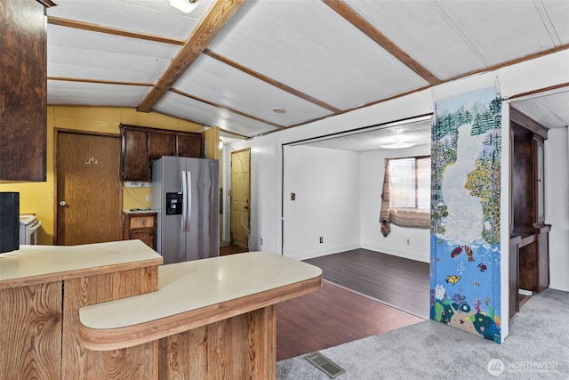 15016 W Thorne Ln SW Unit 7, Lakewood, WA 98498 - kitchen with stainless steel fridge with ice dispenser, wood finished floors, vaulted ceiling, baseboards, and light countertops