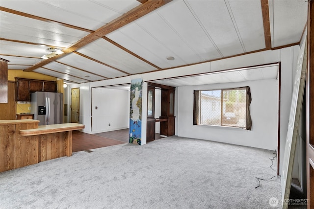 15016 W Thorne Ln SW Unit 7, Lakewood, WA 98498 - unfurnished living room featuring dark colored carpet and lofted ceiling