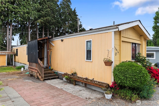 15016 W Thorne Ln SW Unit 7, Lakewood, WA 98498 - view of front of property featuring a patio area and entry steps