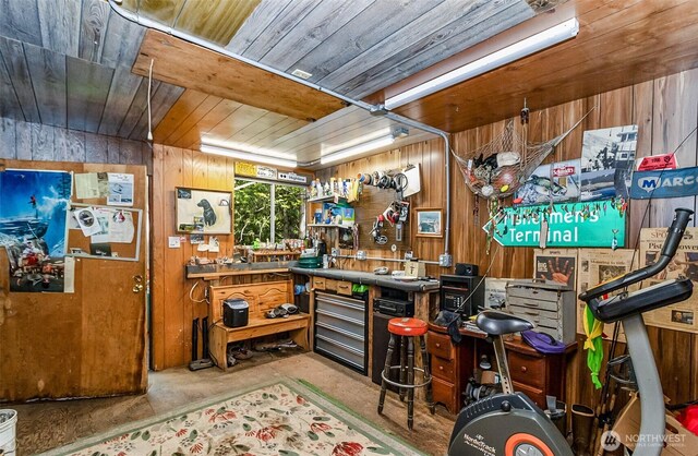 18242 643rd Ave NE Unit 54, 53, Baring, WA 98224 - bar area with a workshop area, wooden ceiling, wooden walls, and concrete flooring