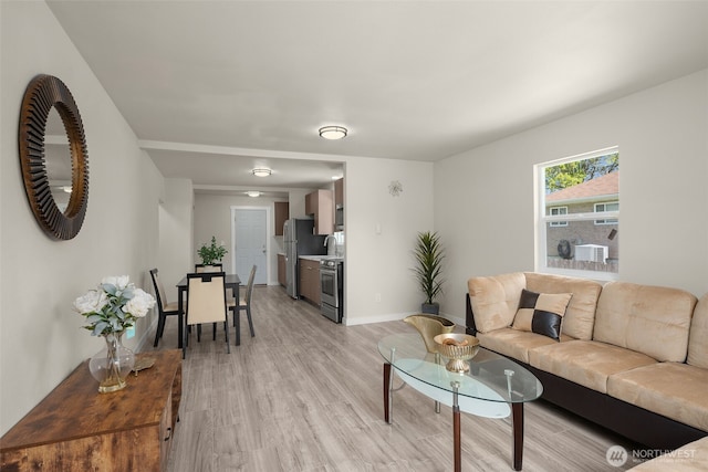 1319 E 56th St, Tacoma, WA 98404 - living room with light wood finished floors and baseboards