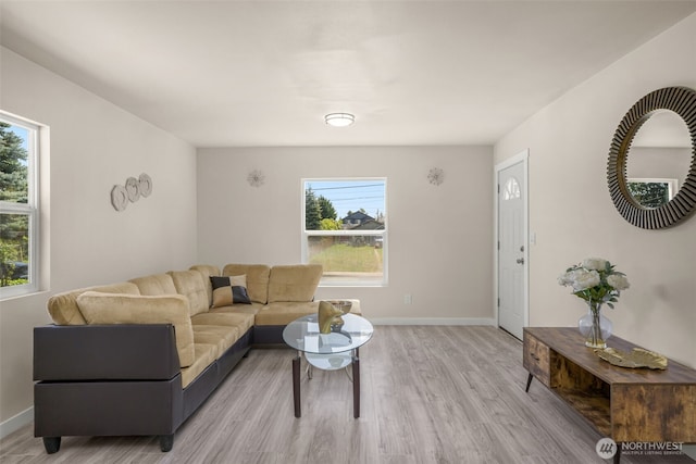 1319 E 56th St, Tacoma, WA 98404 - living room featuring light wood-type flooring and baseboards