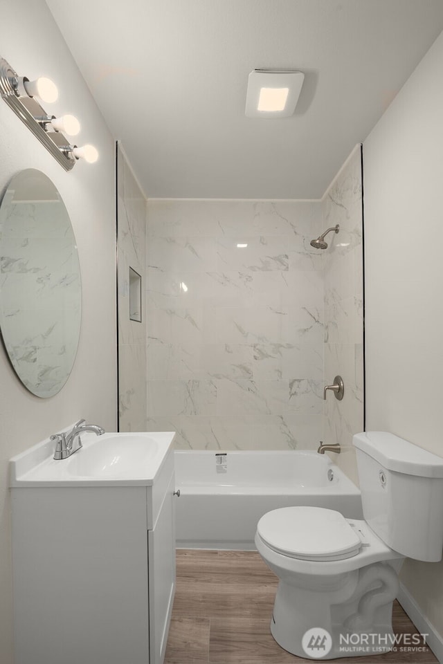 1319 E 56th St, Tacoma, WA 98404 - full bathroom with toilet, wood finished floors, shower / washtub combination, and vanity