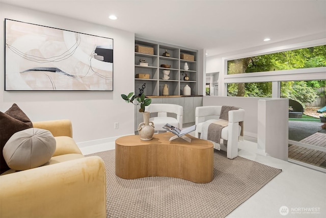 sitting room with recessed lighting and baseboards