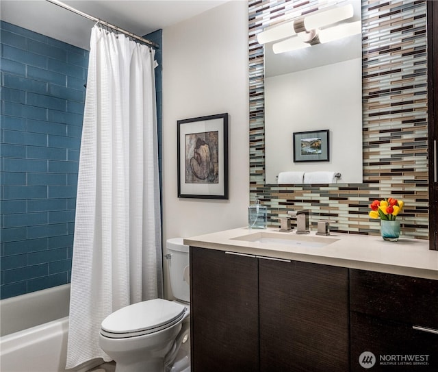 bathroom with toilet, decorative backsplash, vanity, and shower / bath combo with shower curtain