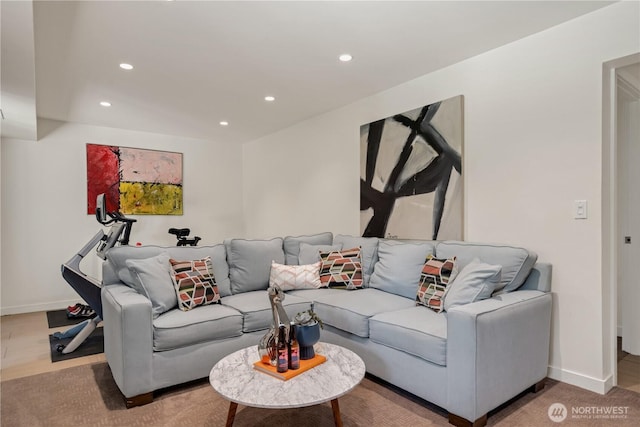 living area with recessed lighting, baseboards, and light wood finished floors