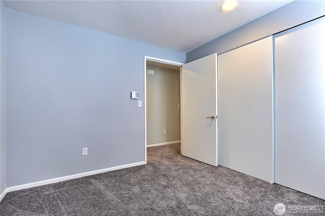 unfurnished bedroom with carpet floors and a closet