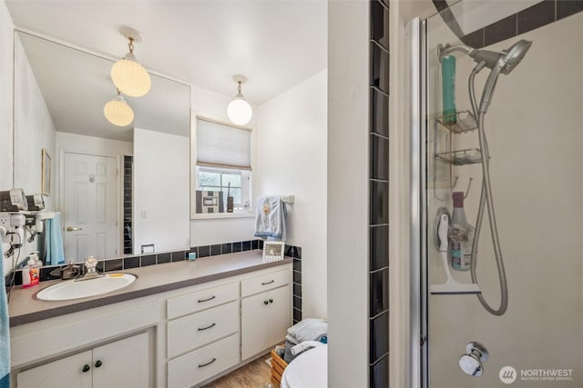 5418 Nootka Loop, Blaine, WA 98230 - full bathroom featuring walk in shower, vanity, and wood finished floors