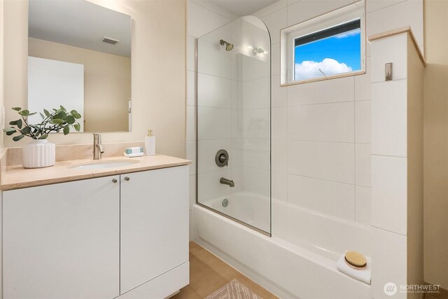 bathroom with vanity, shower / bathtub combination, and tile patterned floors