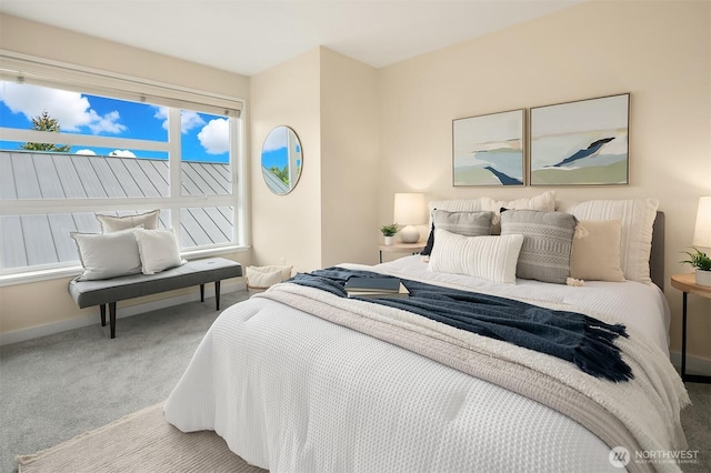 carpeted bedroom with baseboards
