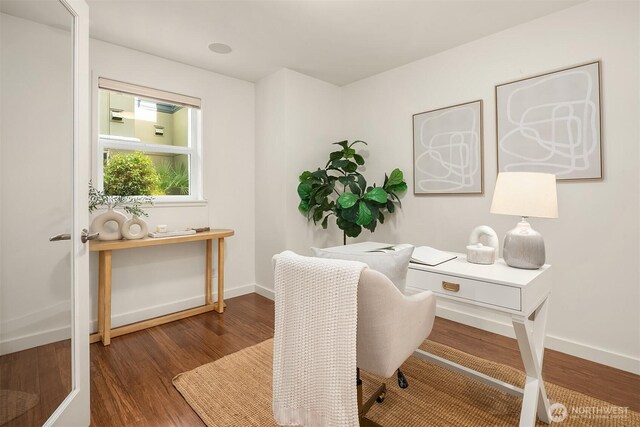 home office featuring wood finished floors and baseboards