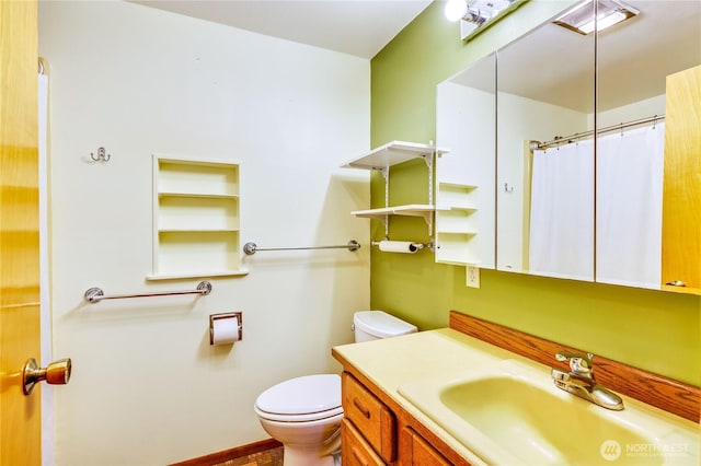 37611 Hansville Rd NE, Hansville, WA 98340 - full bathroom featuring toilet, vanity, curtained shower, and baseboards