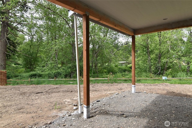 view of patio featuring a forest view