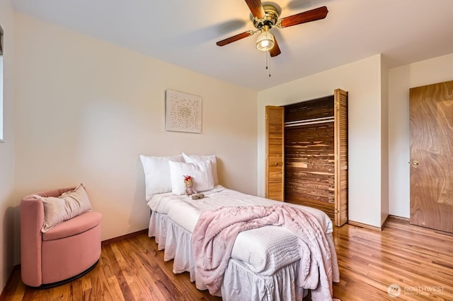2545 NE 204th St, Shoreline, WA 98155 - bedroom with wood finished floors, ceiling fan, baseboards, and a closet