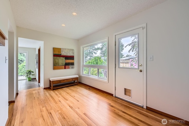 2545 NE 204th St, Shoreline, WA 98155 - entrance foyer with plenty of natural light, a textured ceiling, light wood-type flooring, recessed lighting, and baseboards
